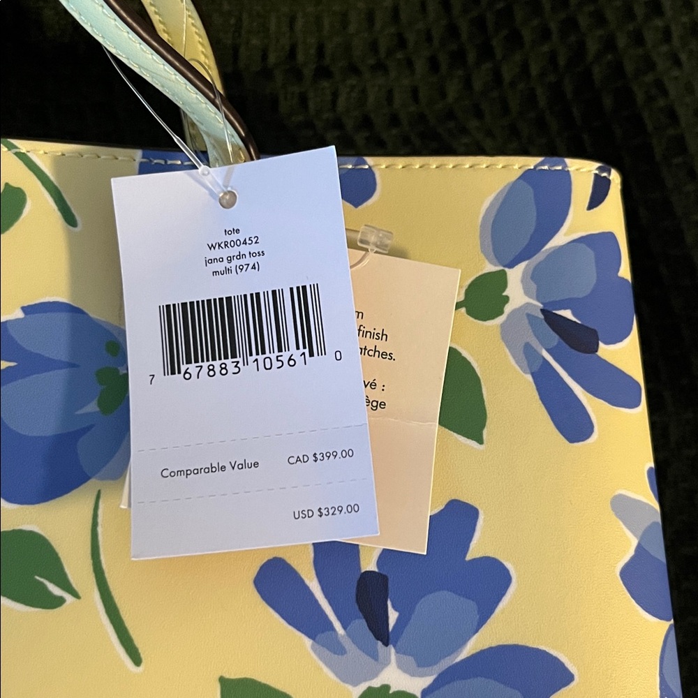 Kate Spade Yellow and Blue Floral Tote-never used
Two small dots on bottom - Picture 2 of 3